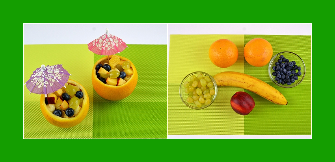 Leckerer Obstsalat mit Bananen Orange Trauben Pfirsich und Blaubeeren
